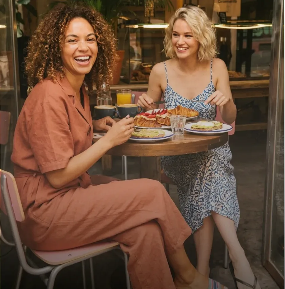Two friends having brunch at a Wheretogo partner café